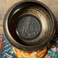 Tibetan Singing Bowl etched Om Mani Padme Hum symbols, carved on the inside